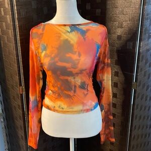 Sheen. Sheer orange, multicolor top see-through.